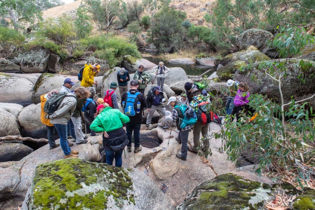 Citizen scientists studying stream flows and granitic rock formations in the Strathbogie Ranges. 